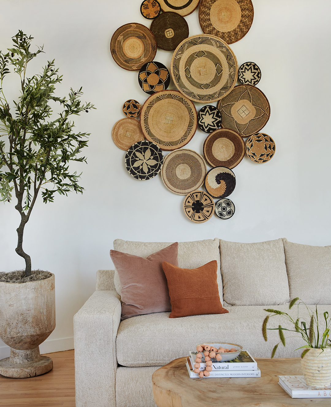 sofa corner, with a wall of baskets from Rwanda