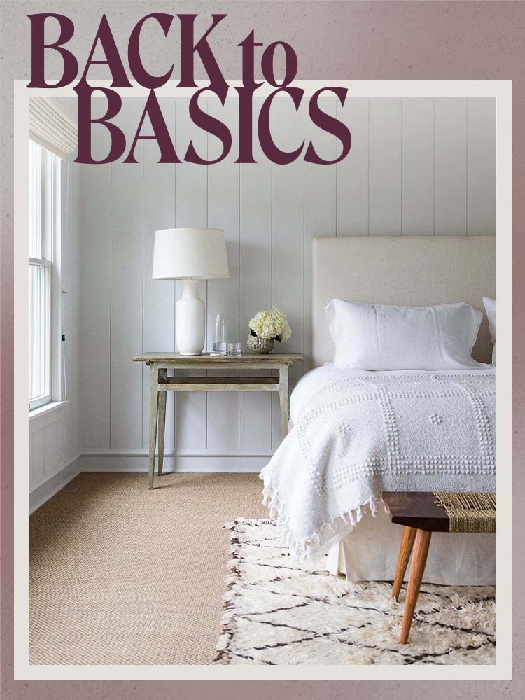 bedroom with cream rug over beige carpet