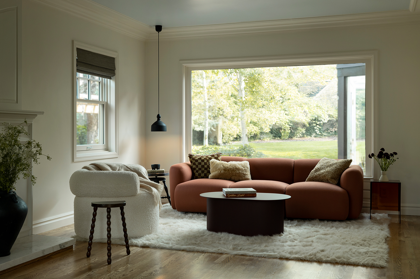 cozy white living room with red couch