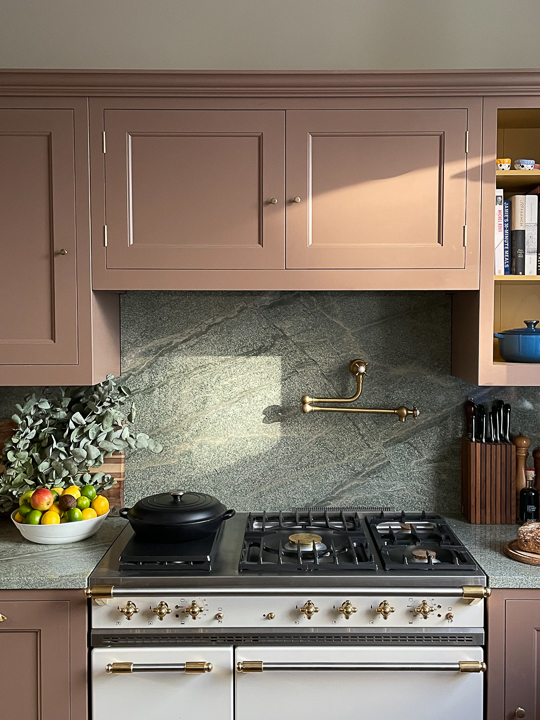 mauve cabinets around oven hood