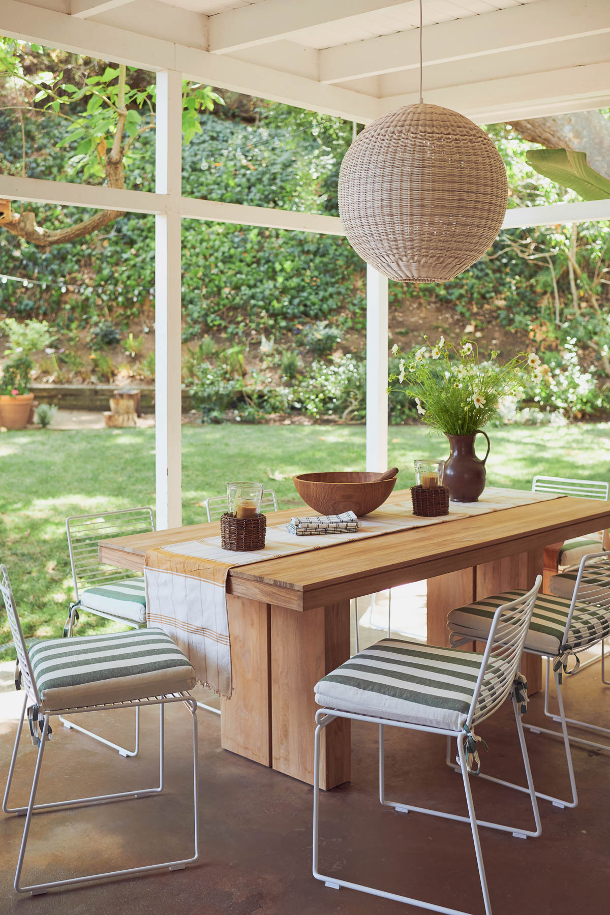 screened in porch with dining table