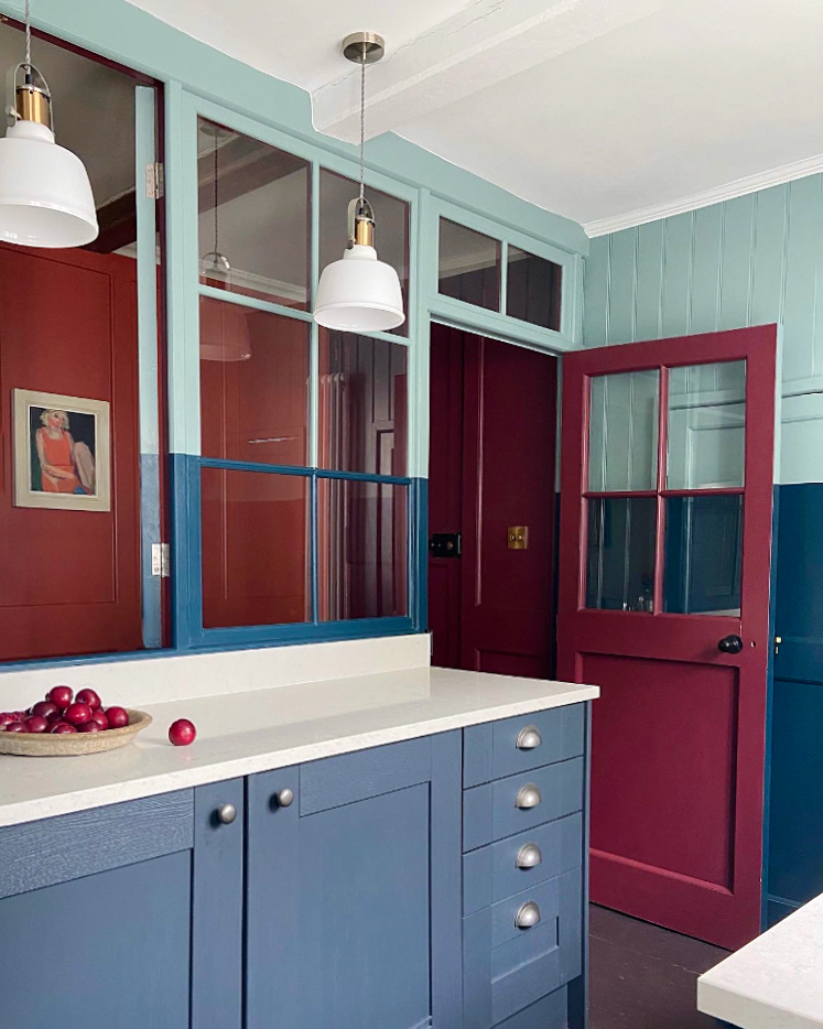 navy kitchen cabinets and burgundy door