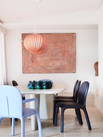 dining room with red artwork