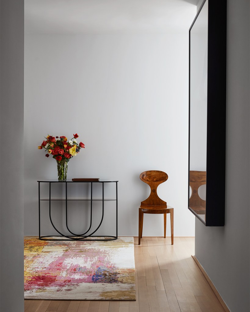 foyer with red pink rug