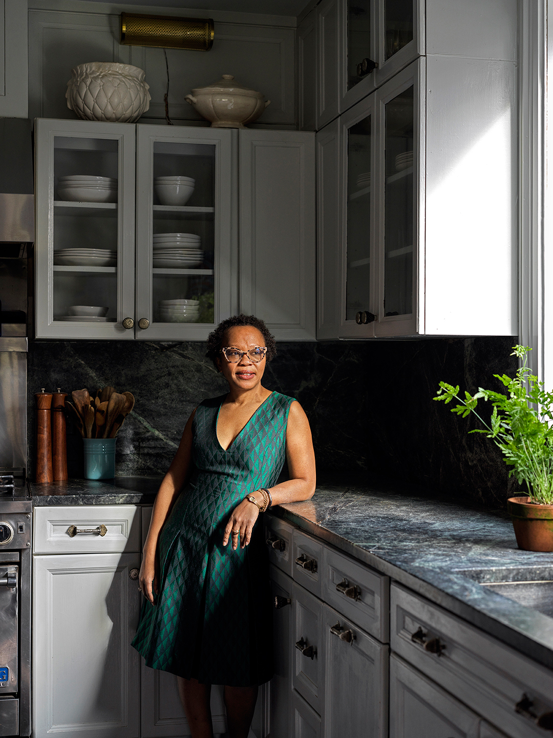 woman leaning on counter