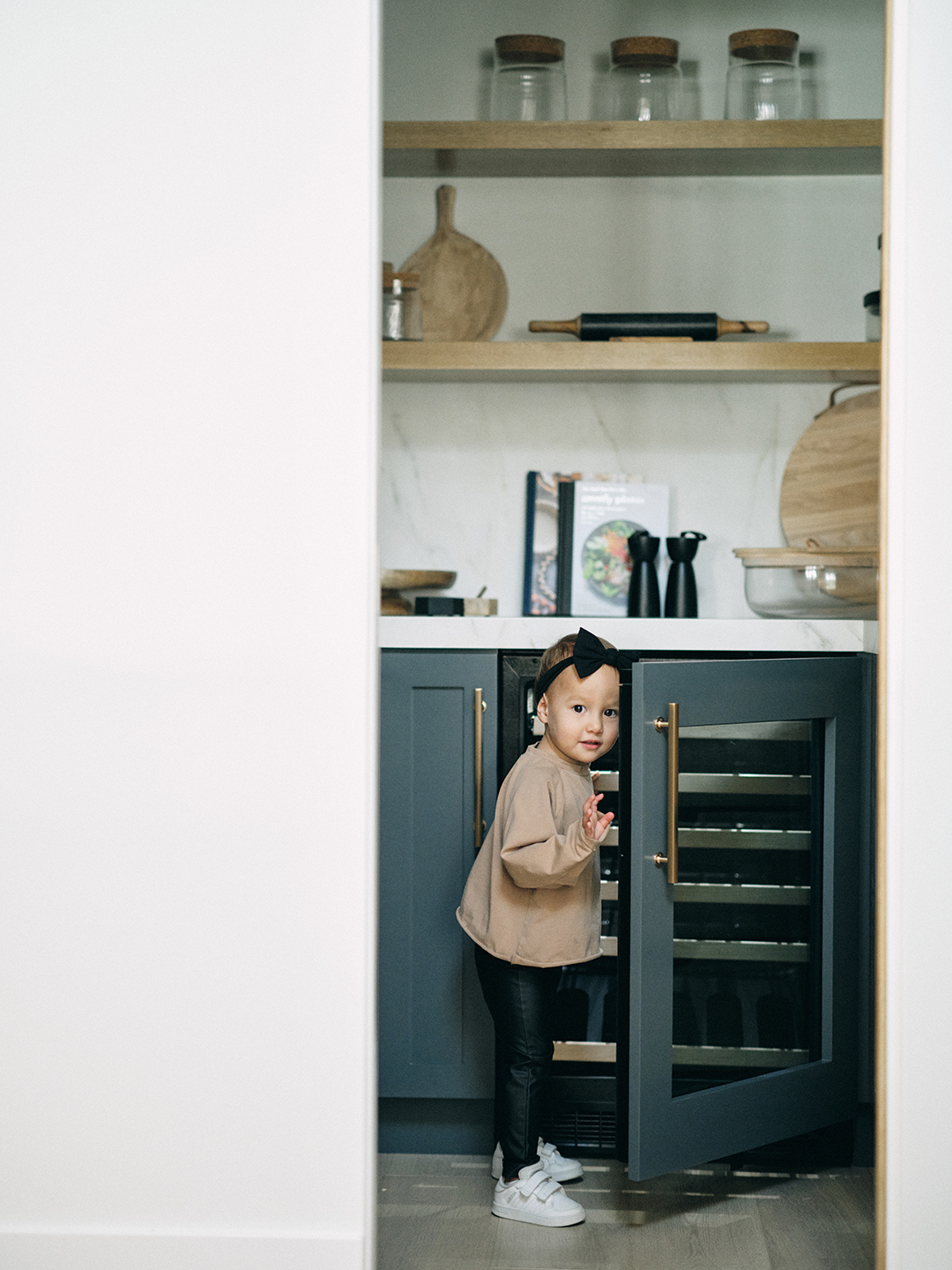 kid opening mini fridge