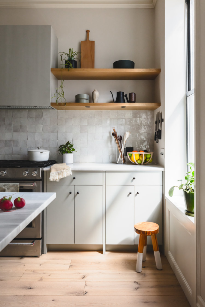 Green Kitchen Cabinets and Wooden Floating Shelves