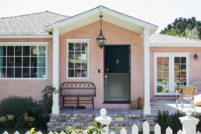 pink home exterior with white trim