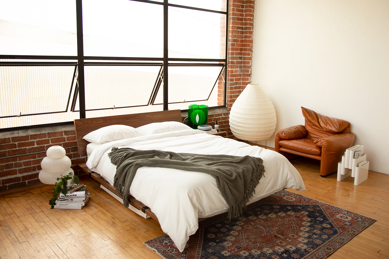 bedroom with large industrial windows