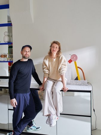 portrait of two people in a small kitchen