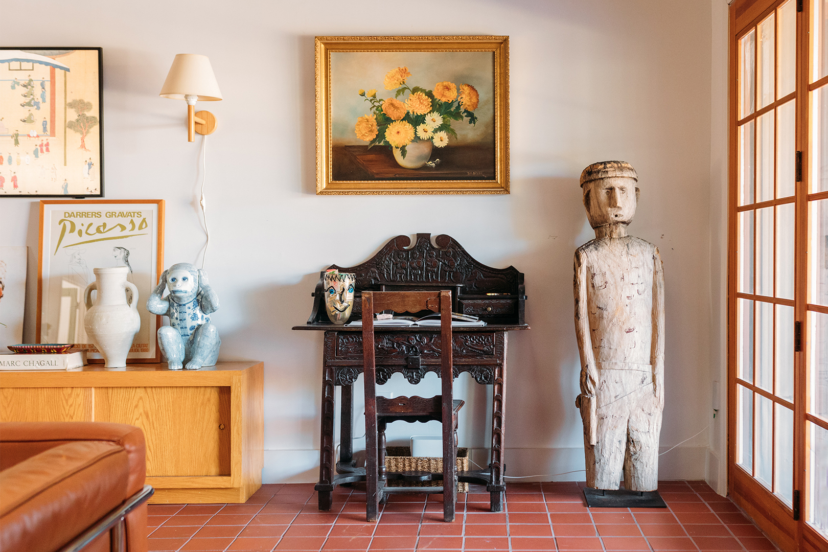 vintage carved desk and human statue