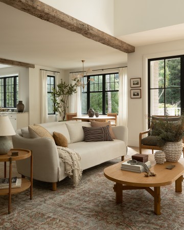 living room with curved grey sofa