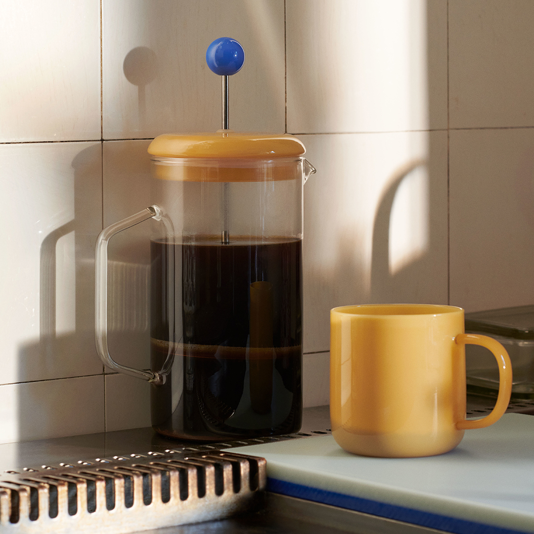 yellow french press and mug