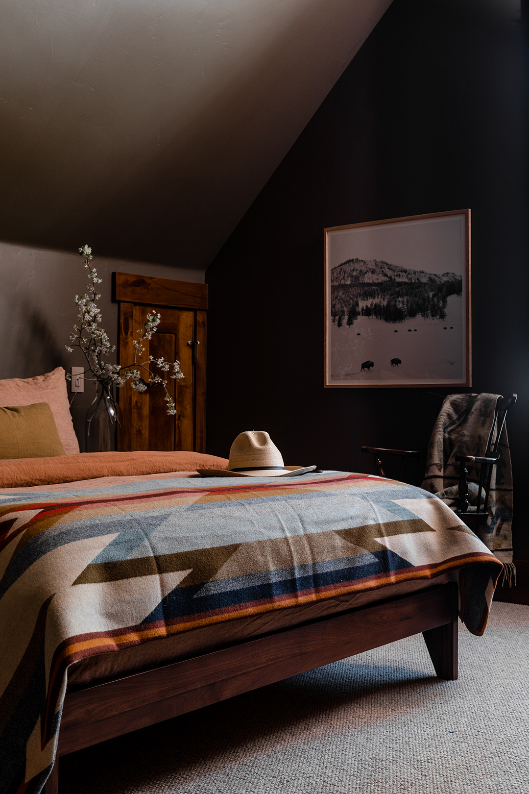 brown bedroom with sloped ceiling