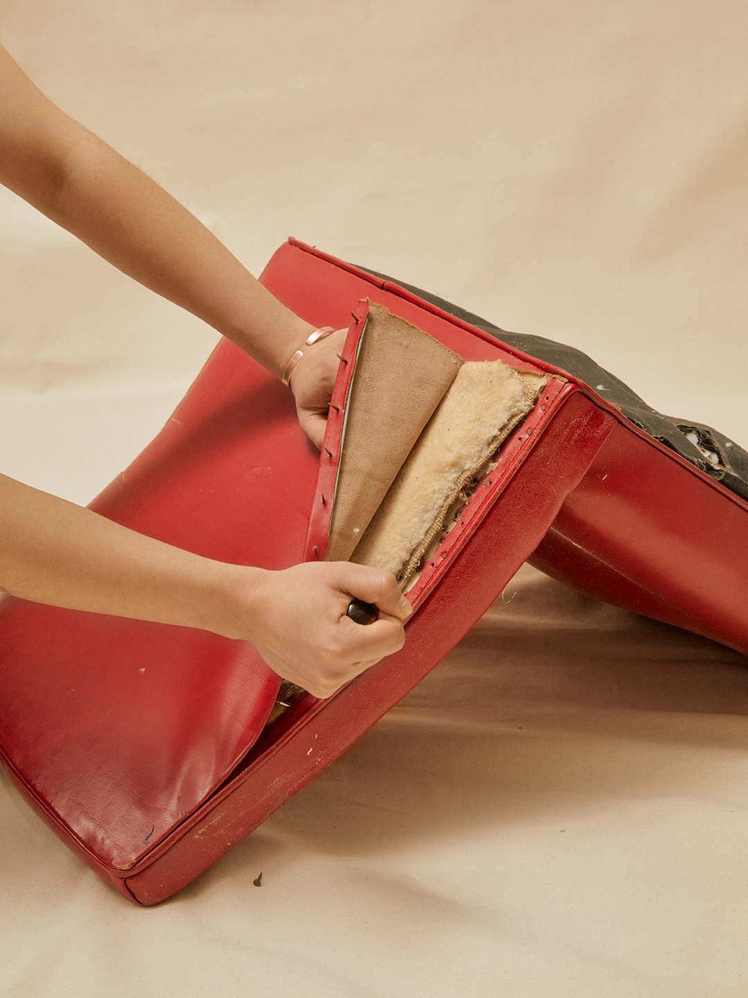 hand removing fabric from chair