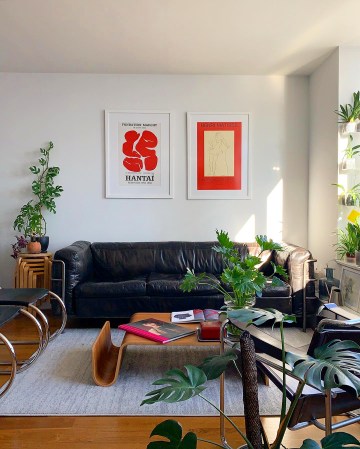 living room with black leather sofa