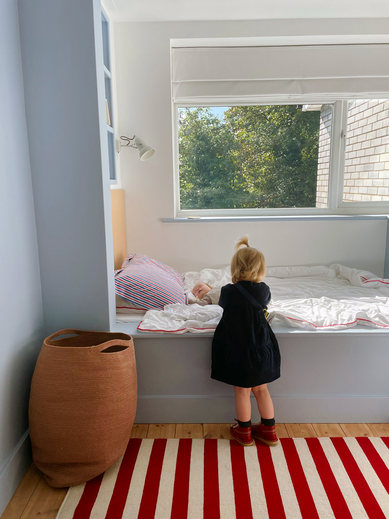 little girl touching mattress