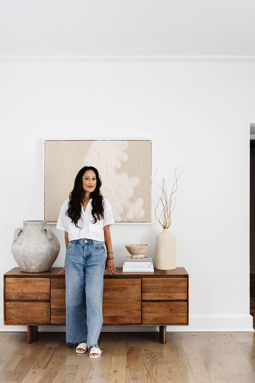 woman leaning on credenza