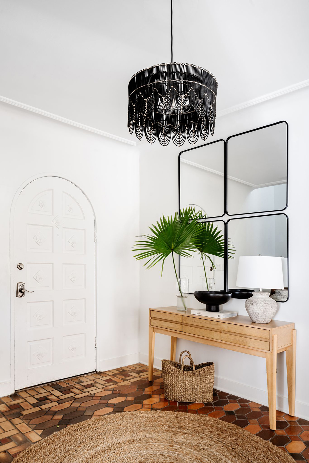 tiled entryway floor with wood console