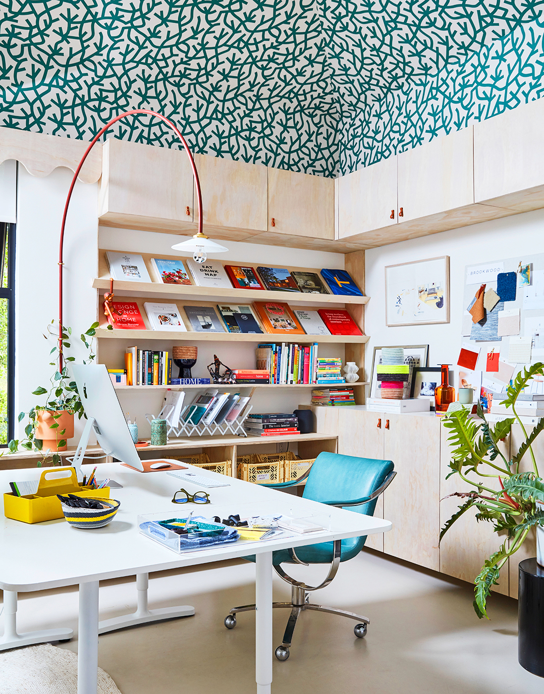 blue-green wallpapered office ceiling