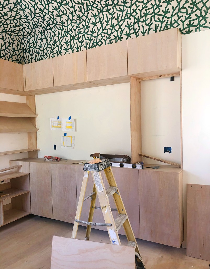 wood cabinets being installed