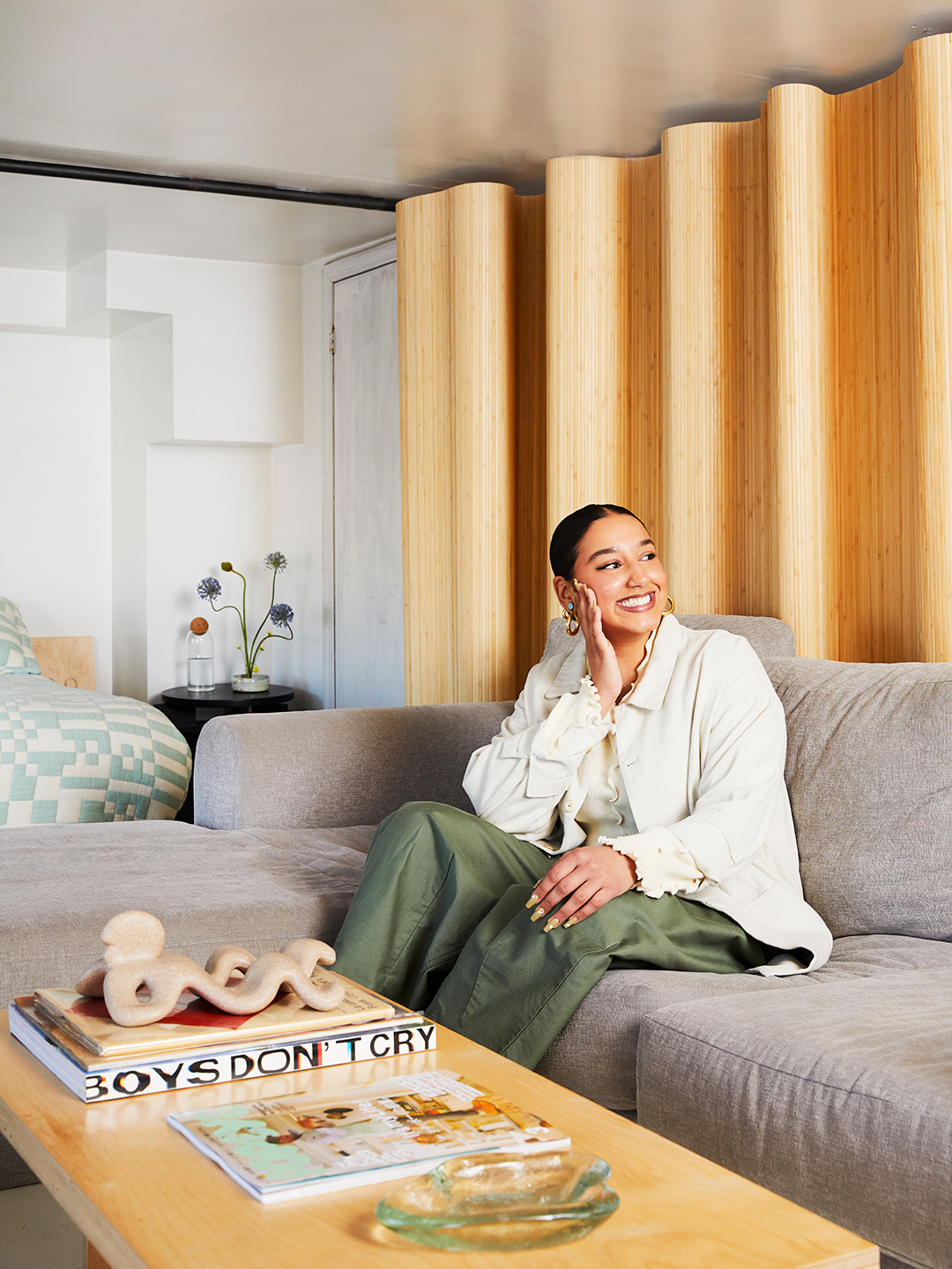 portrait of a woman on grey couch