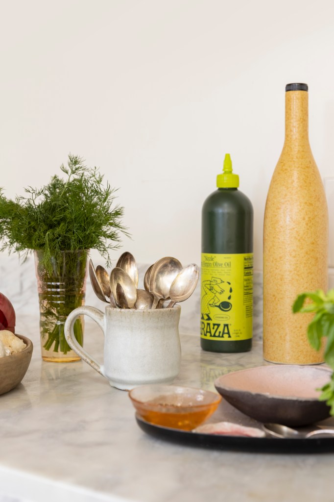 Olive oil and pantry items on countertop