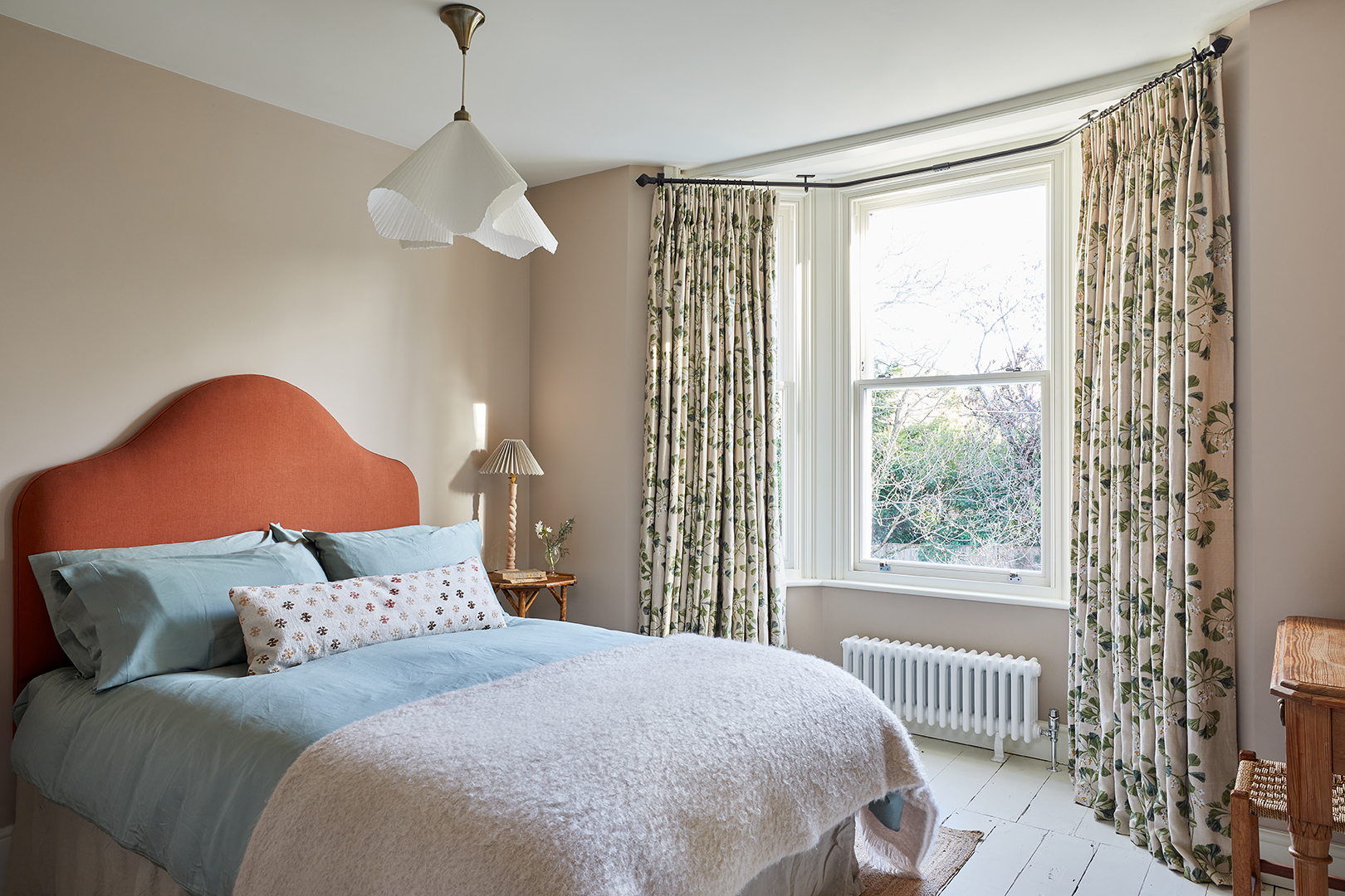 cozy bedroom with red bed frame