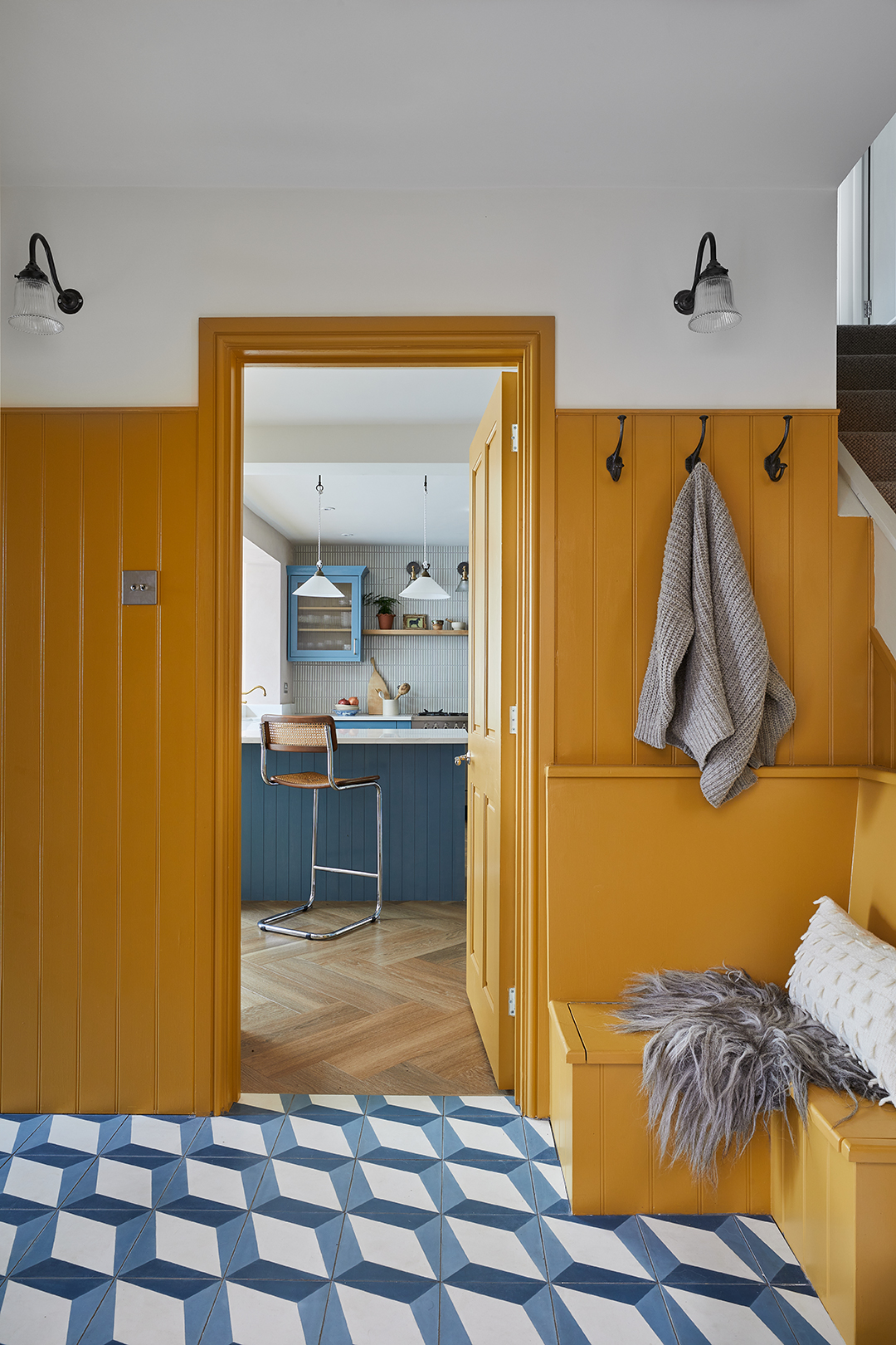 yellow entry looking into kitchen