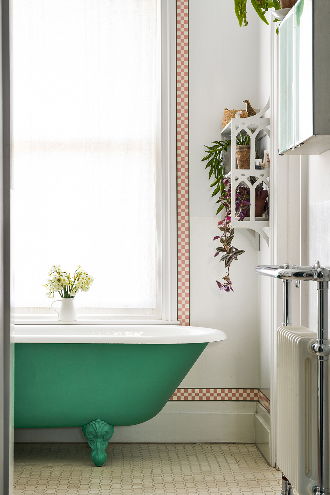 bathroom with green clawfoot tub