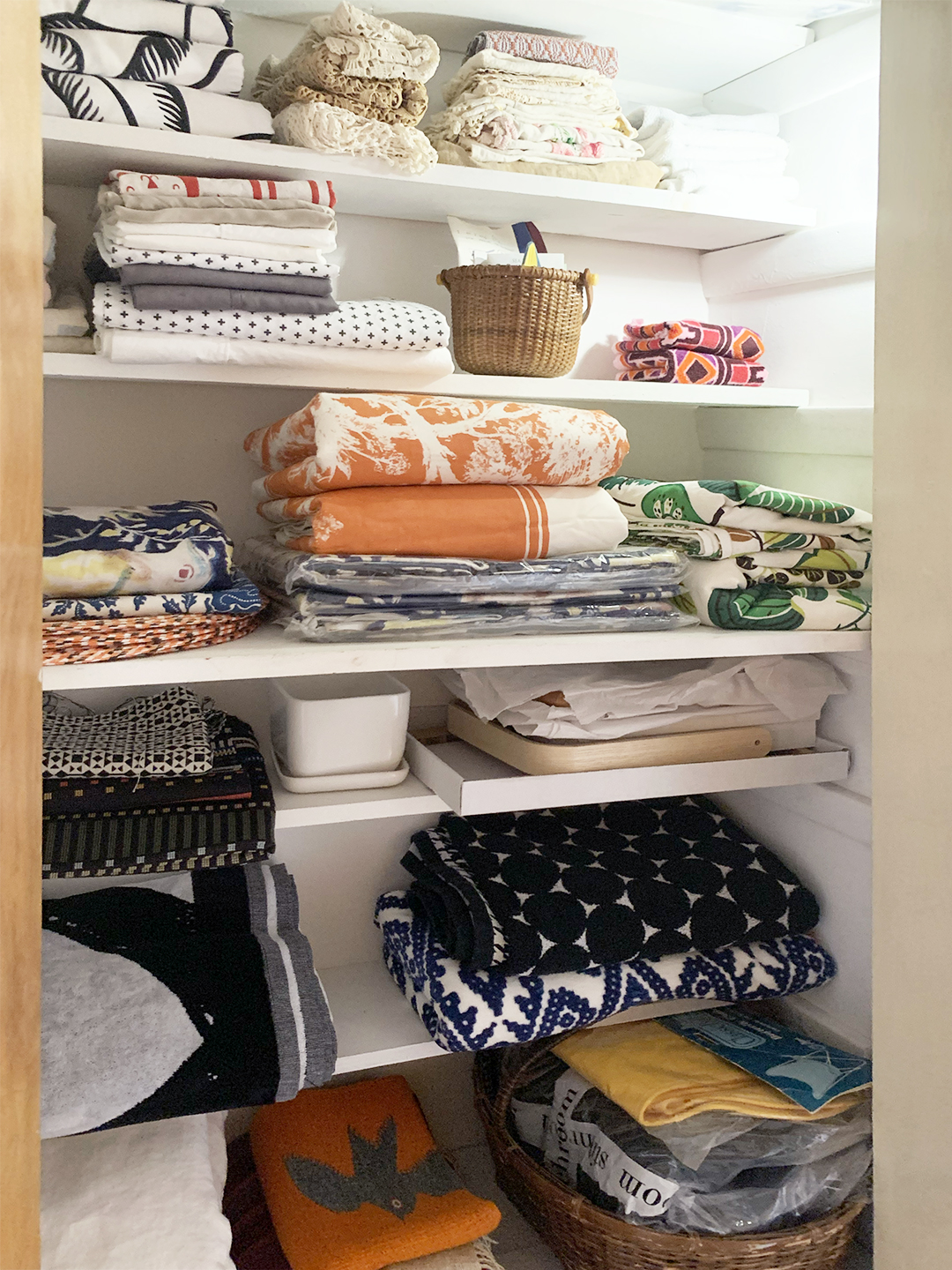 closet of folded textiles