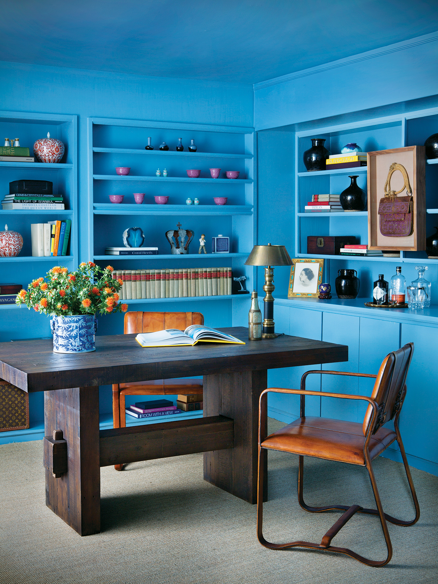 Blue Painted Office and Built Ins with Leather Chair and Wood Desk