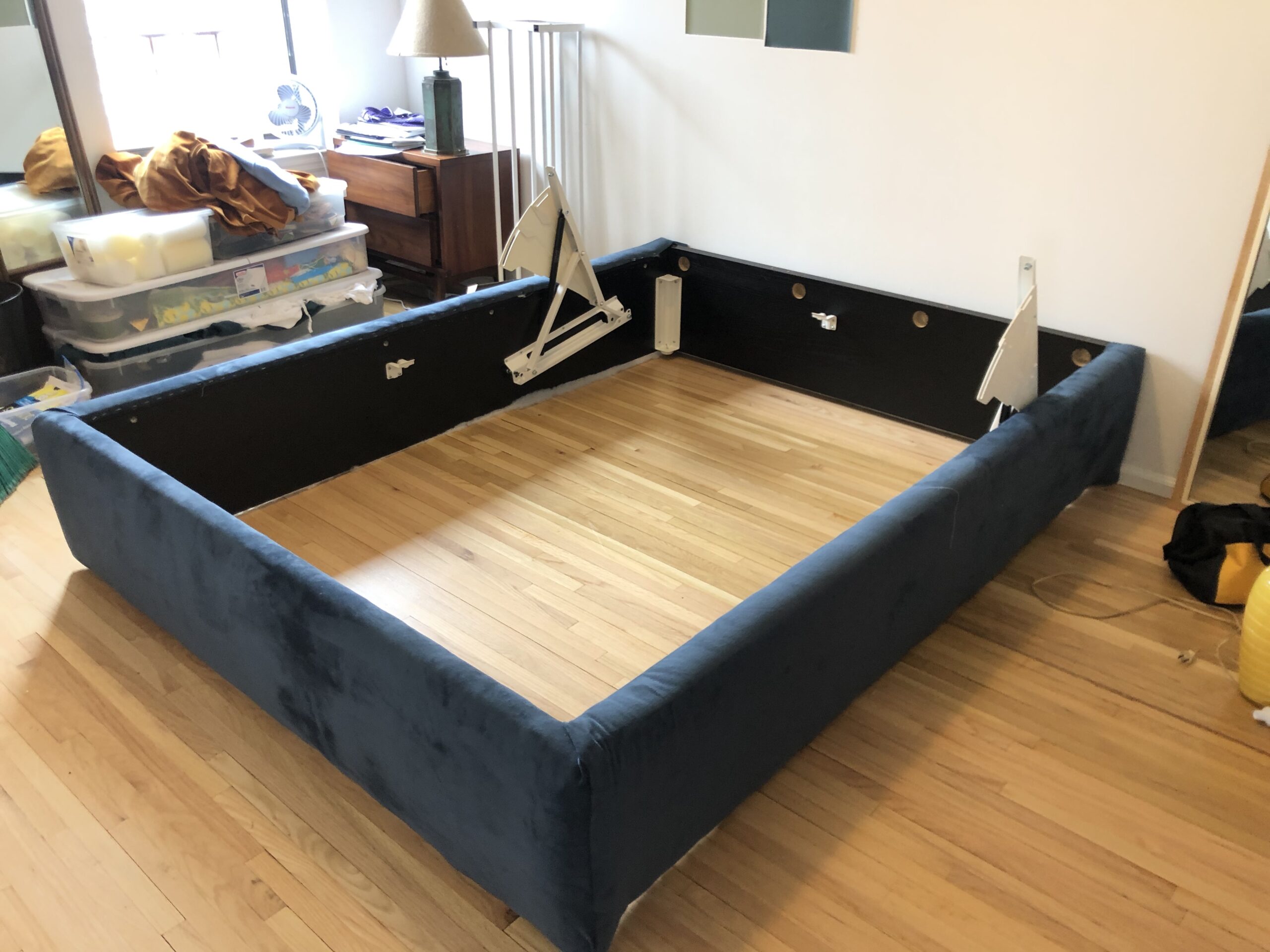 bed base upholstered in blue velvet