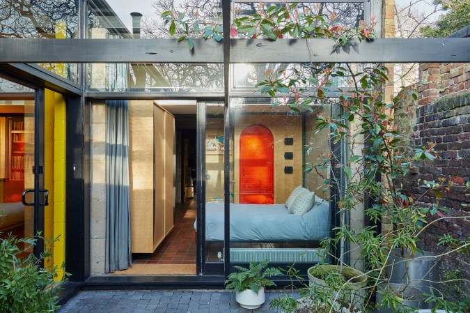 glass windows looking into bedroom