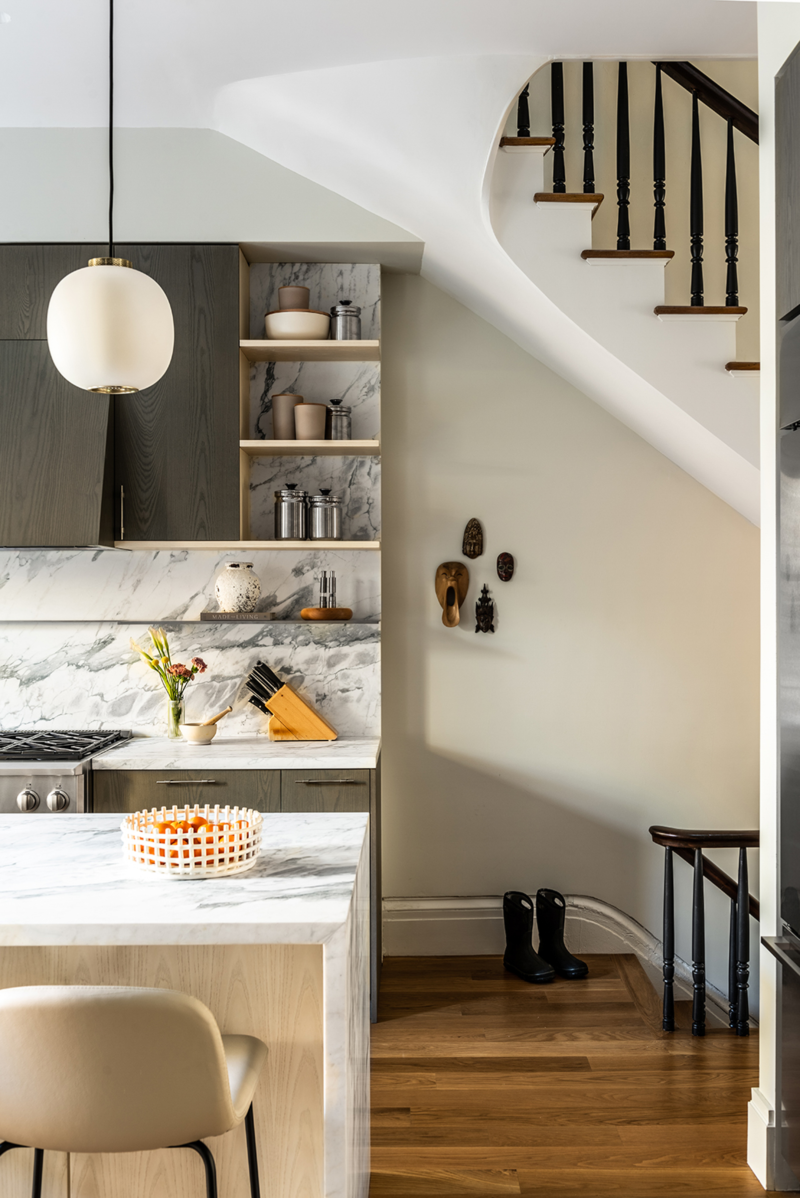 modern gray kitchen underneath staircase