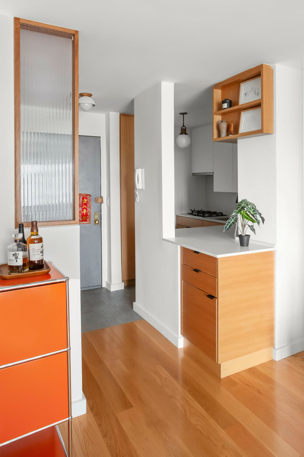 kitchen cabinets with orange credenza