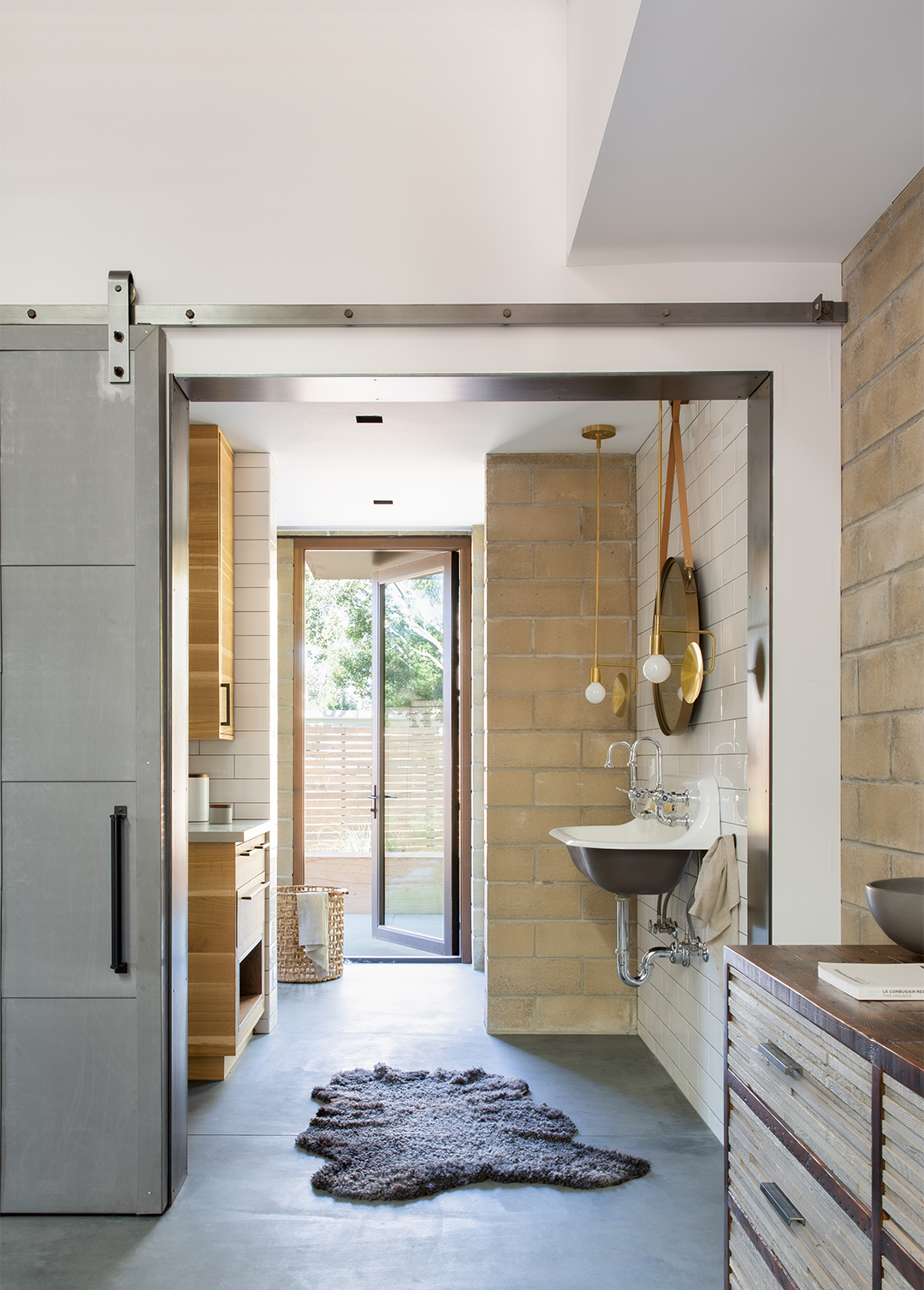 steel barn door in front of bathroom