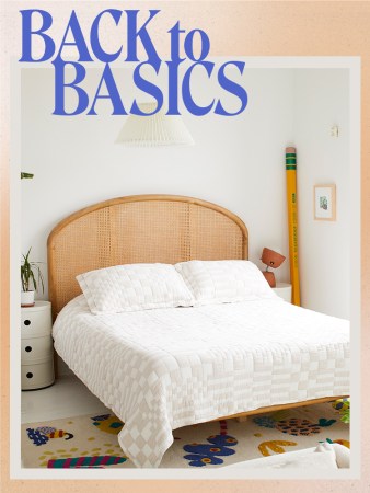 white bed with quilted comforter and brown woven headboard