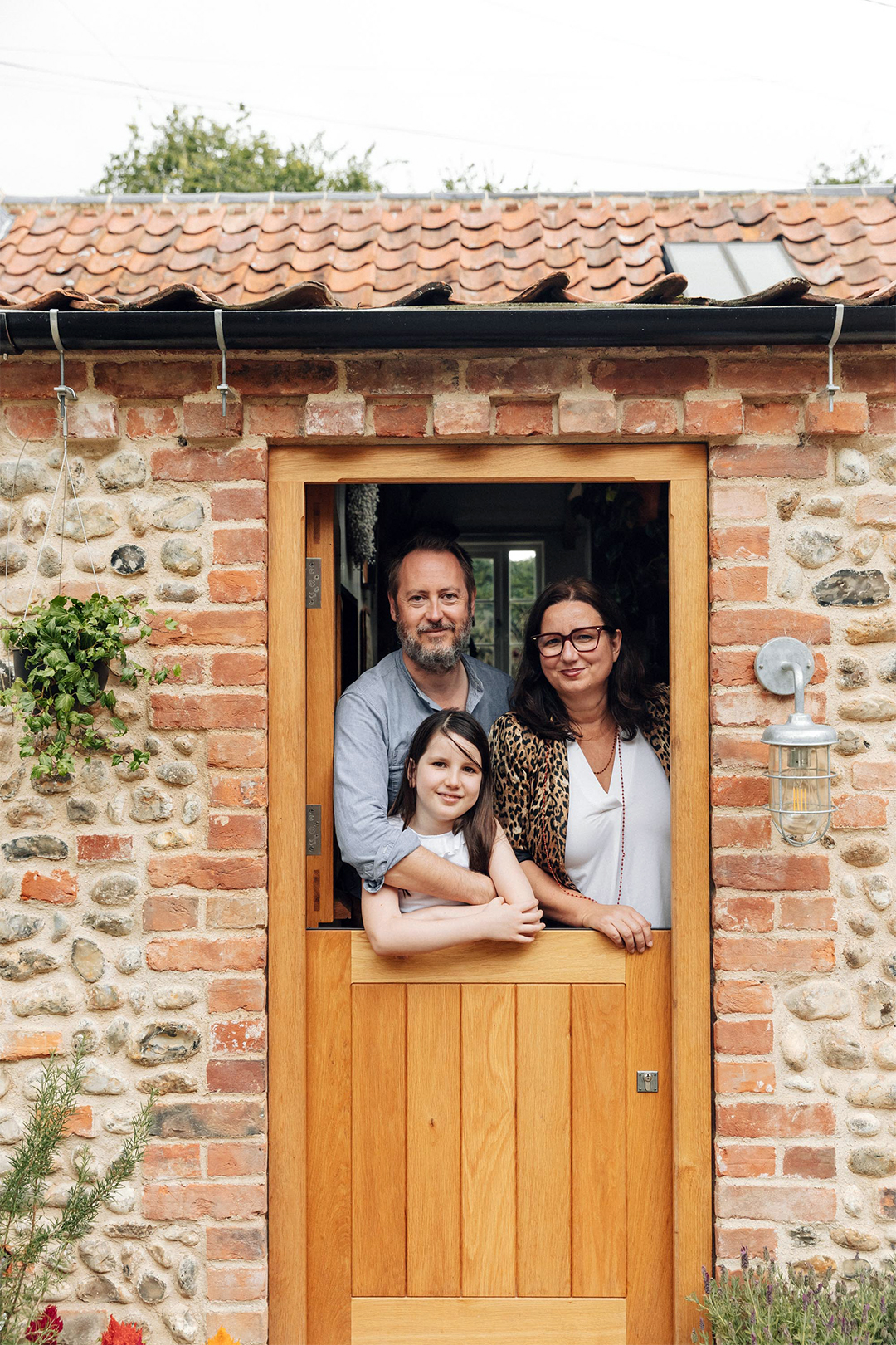 family standing in doorway