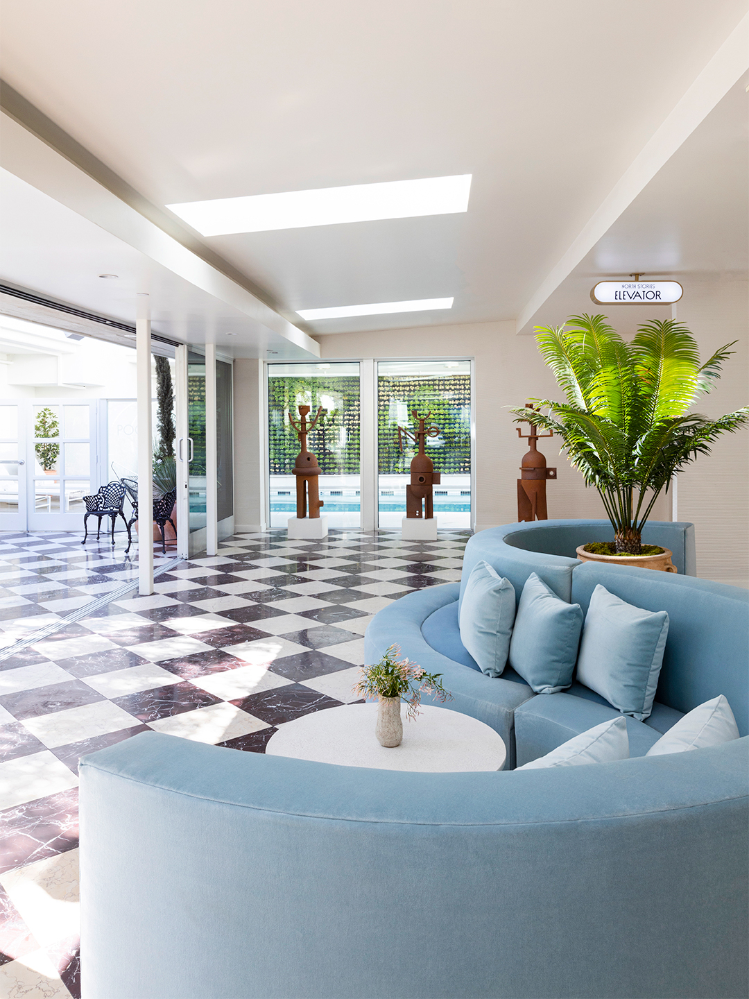 Blue curved sofa in hotel lobby entrance