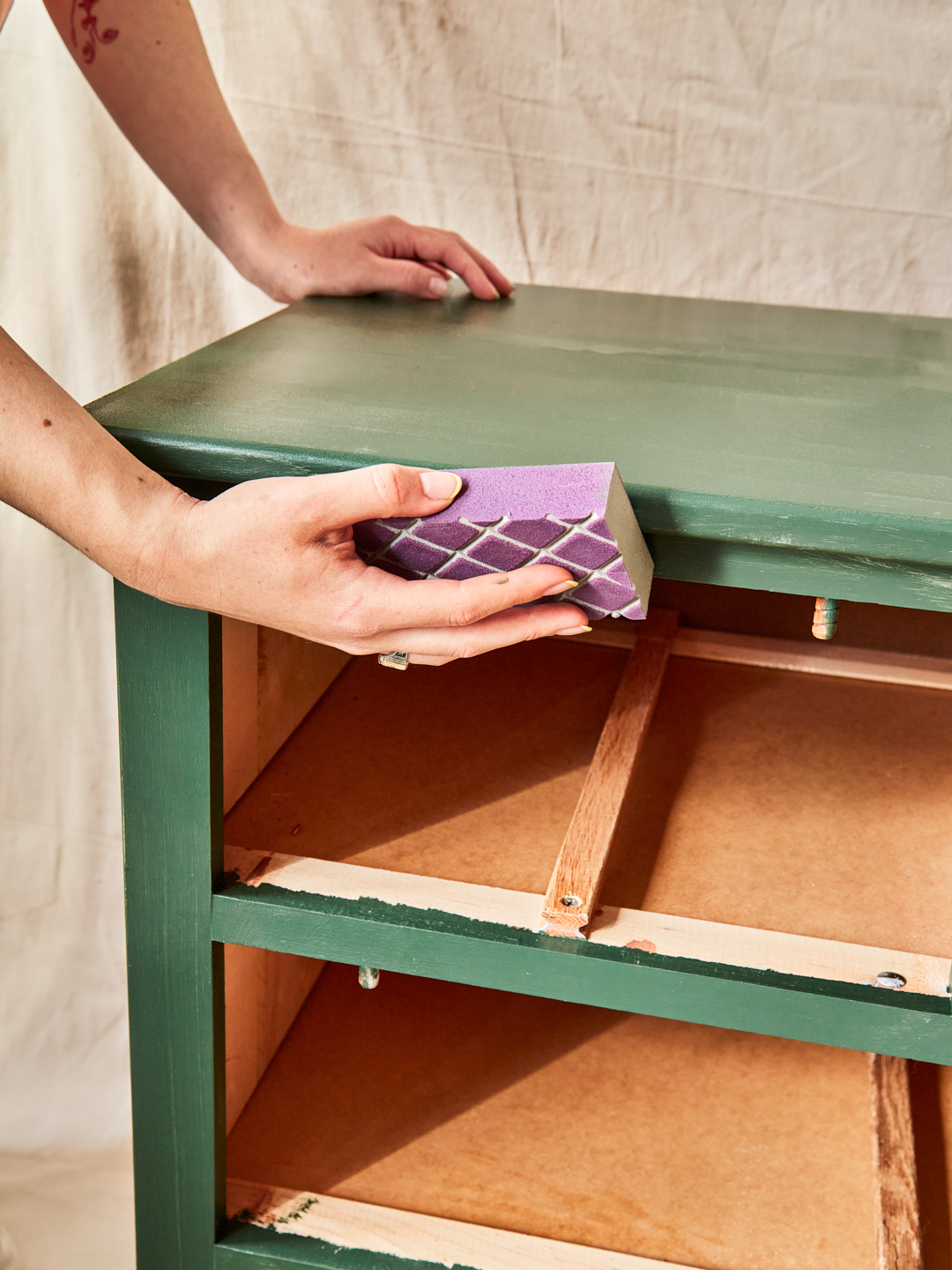 sand dried paint blobs on green dresser