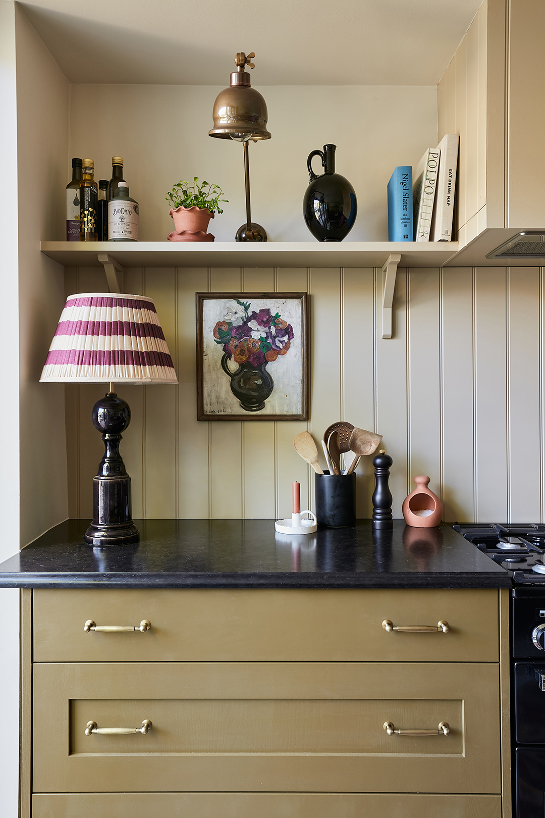 black counters and green cabinet