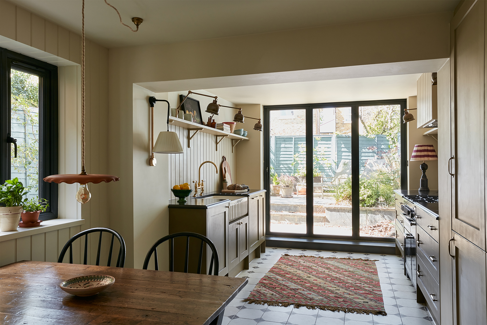 galley kitchen with green cabinets