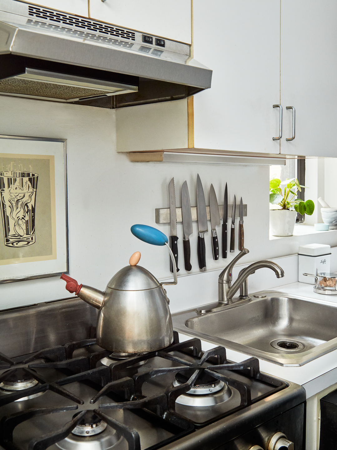 stove with silver kettle