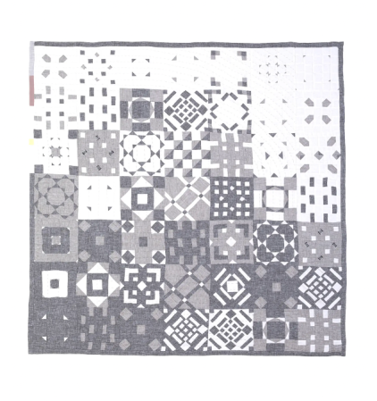  grey patchwork quilt