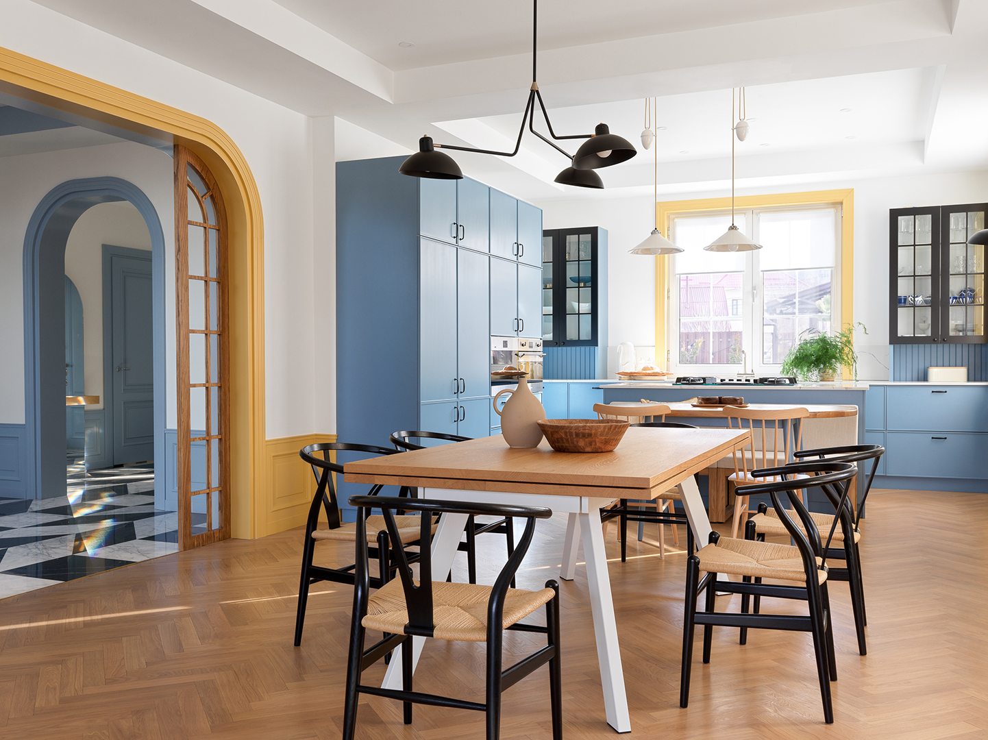 long dining table in open kitchen