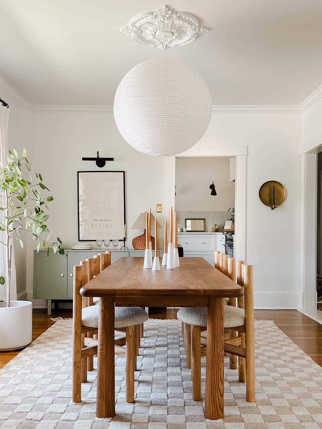 dining room with sage green credenza