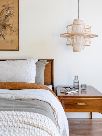 wood and paper lantern over nightstand