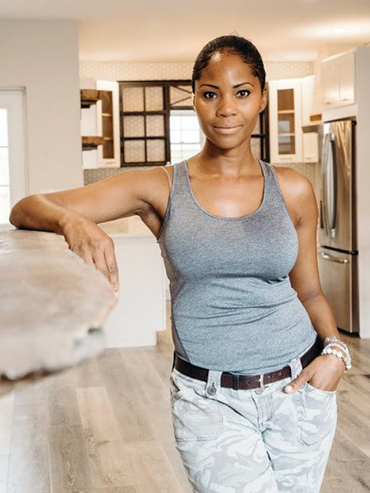 woman leaning on counter