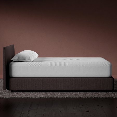  side view of casper nova hybrid mattress on wooden bed frame